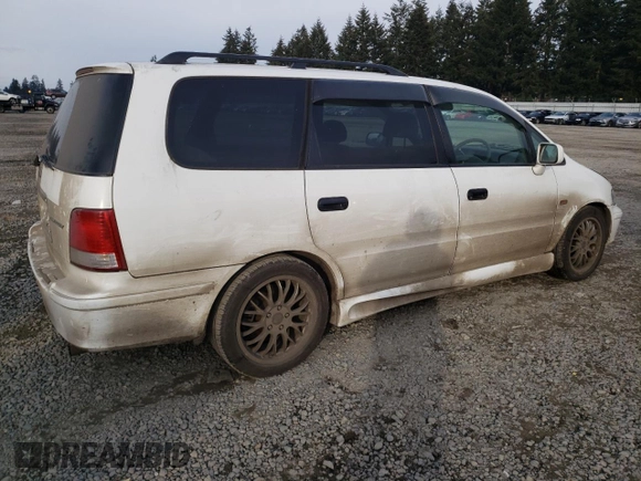 1998 Honda Odyssey with VIN RA31038664, listed as a Copart auction lot 43051785 with 106,084 mi miles and Salvage title. Bid and sale history available at DreamBid. Image 3.