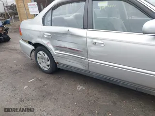 1997 Honda Civic EX with VIN 2HGEJ8643VH561244, listed as a IAAI auction lot 41810988 with 130,000 mi miles. Bid and sale history available at carsss.com. Image 6.