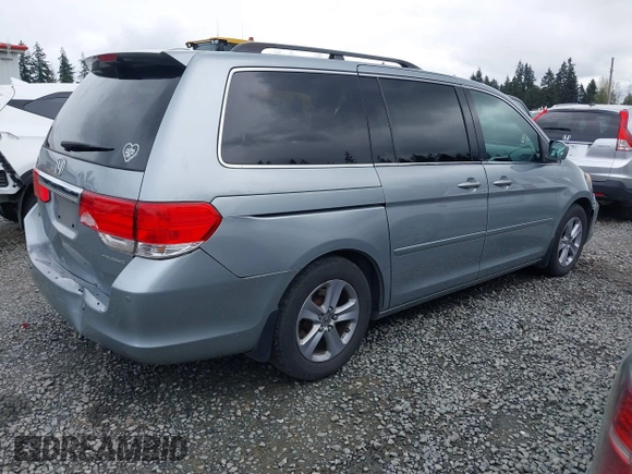 2008 Honda Odyssey Touring with VIN 5FNRL38908B098771, listed as a IAAI auction lot 41878646 with 167,834 mi miles. Bid and sale history available at carsss.com. Image 4.