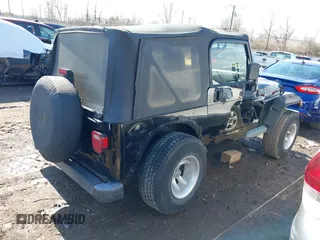 2002 Jeep Wrangler X with VIN 1J4FA39S52P770664, listed as a IAAI auction lot 41661580 with 122,445 mi miles. Bid and sale history available at carsss.com. Image 4.