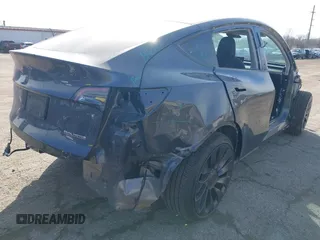 2023 Tesla Model Y Performance with VIN 7SAYGDEF7PF590750, listed as a IAAI auction lot 41694002 with Not Provided miles and . Bid and sale history available at DreamBid. Image 4.