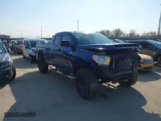 2014 Toyota Tundra 4WD Truck SR with VIN 5TFUY5F1XEX379823, listed as a IAAI auction lot 41761483 with 131,987 mi miles. Bid and sale history available at carsss.com. Image 1.