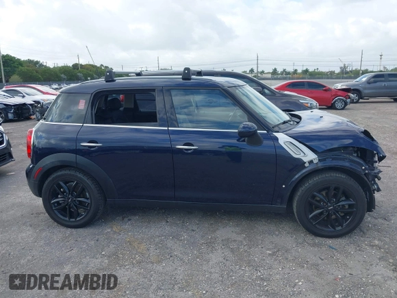 2013 MINI Countryman with VIN WMWZB3C58DWM07817, listed as a IAAI auction lot 41962291 with 60,763 mi miles and . Bid and sale history available at DreamBid. Image 14.