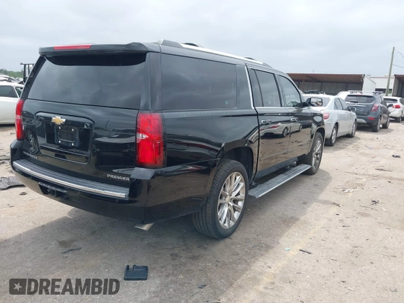 2019 Chevrolet Suburban Premier with VIN 1GNSKJKJ3KR231852, listed as a IAAI auction lot 41957728 with 136,263 mi miles and . Bid and sale history available at DreamBid. Image 4.