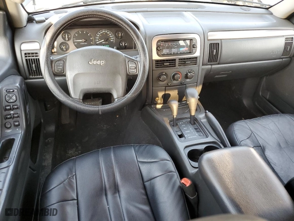 2002 Jeep Grand Cherokee Laredo with VIN 1J4GW48N32C180185, listed as a Copart auction lot 51988335 with 212,399 mi miles and Salvage Title. Bid and sale history available at carsss.com. Image 10.