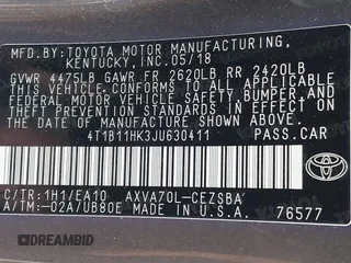 2018 Toyota Camry LE z VIN 4T1B11HK3JU630411, wystawiony jako IAAI lot #41423338 z przebiegiem 134 959 mil mil oraz . Historia ofert i sprzedaży dostępna na DreamBid. Obrazek 9.