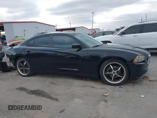2014 Dodge Charger SE with VIN 2C3CDXBG2EH187978, listed as a IAAI auction lot 41246875 with 106,635 mi miles and . Bid and sale history available at DreamBid. Image 13.