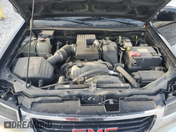 2011 GMC Canyon SLE1 z VIN 1GTH6MFE4B8108346, wystawiony jako Copart lot #53524715 z przebiegiem 169 080 mil mil oraz Szkoda całkowita • Salvage title. Historia ofert i sprzedaży dostępna na DreamBid. Obrazek 11.