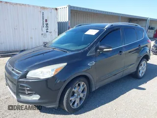 2014 Ford Escape Titanium with VIN 1FMCU0JX6EUB49652, listed as a IAAI auction lot 42136494 with 195,108 mi miles. Bid and sale history available at carsss.com. Image 2.