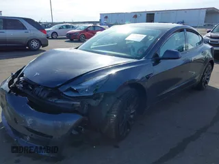 2021 Tesla Model 3 Performance with VIN 5YJ3E1EC3MF082532, listed as a IAAI auction lot 41757905 with 60,431 mi miles and . Bid and sale history available at DreamBid. Image 2.