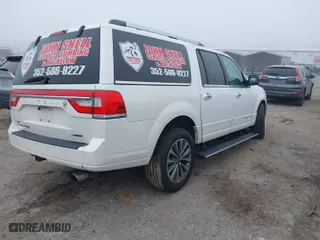 2015 Lincoln Navigator L with VIN 5LMJJ3JT7FEJ05280, listed as a IAAI auction lot 41476190 with 124,580 mi miles. Bid and sale history available at carsss.com. Image 4.