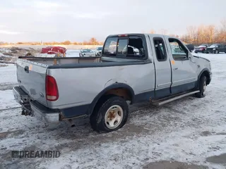 1999 Ford F-150 XL with VIN 1FTRX18LXXNA44916, listed as a IAAI auction lot 41322276 with 1 mi miles. Bid and sale history available at carsss.com. Image 4.