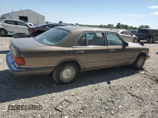 1987 Mercedes-Benz 420 with VIN WDBCA35D0HA311262, listed as a Copart auction lot 71760554 with 185,520 mi miles and Salvage Title. Bid and sale history available at carsss.com. Image 3.