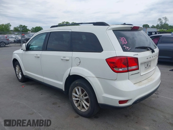 2017 Dodge Journey SXT with VIN 3C4PDCBG4HT572573, listed as a IAAI auction lot 42036006 with 209,854 mi miles and . Bid and sale history available at DreamBid. Image 14.
