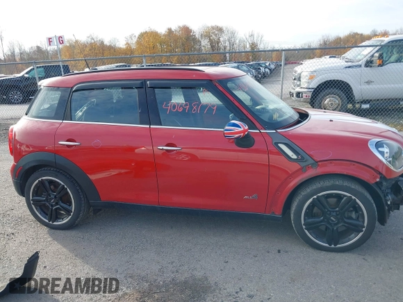 2015 MINI Cooper Countryman S with VIN WMWZC5C51FWP49282, listed as a IAAI auction lot 40698179 with 63,037 mi miles. Bid and sale history available at carsss.com. Image 14.