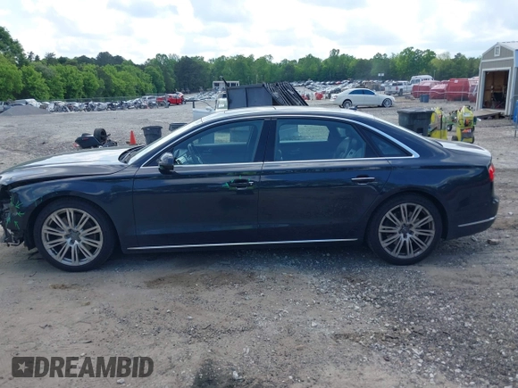2015 Audi A8 4.0T with VIN WAU32AFD4FN002477, listed as a IAAI auction lot 42157514 with 151,729 mi miles and . Bid and sale history available at DreamBid. Image 14.