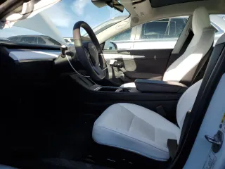 2023 Tesla Model 3 with VIN 5YJ3E1EAXPF600008, listed as a Copart auction lot 51868055 with 58,733 mi miles and Salvage title. Bid and sale history available at DreamBid. Image 7.