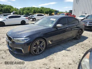 2018 BMW 5 Series M550i xDrive with VIN WBAJB9C56JB286479, listed as a Copart auction lot 57108645 with 71,782 mi miles and Salvage title. Bid and sale history available at DreamBid. Image 1.