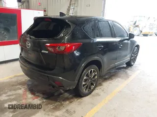 2016 Mazda CX-5 Grand Touring with VIN JM3KE2DY9G0705127, listed as a IAAI auction lot 41412910 with 181,993 mi miles. Bid and sale history available at carsss.com. Image 4.