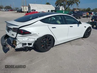 2022 Tesla Model S Plaid with VIN 5YJSA1E64NF484904, listed as a IAAI auction lot 41594464 with 25,299 mi miles and . Bid and sale history available at DreamBid. Image 4.