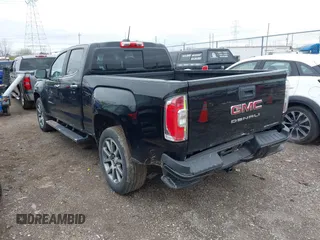 2021 GMC Canyon 4WD Denali with VIN 1GTG6EEN6M1260580, listed as a IAAI auction lot 41918693 with 52,085 mi miles. Bid and sale history available at carsss.com. Image 3.