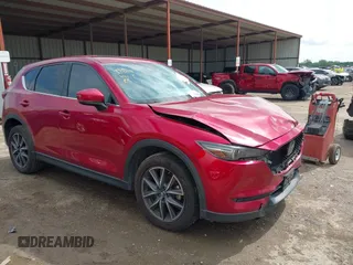 2018 Mazda CX-5 Grand Touring z VIN JM3KFADM7J1357401, wystawiony jako IAAI lot #42106012 z przebiegiem 119 420 mil mil oraz . Historia ofert i sprzedaży dostępna na DreamBid. Obrazek 1.