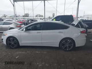 2019 Ford Fusion Titanium with VIN 3FA6P0K90KR236674, listed as a IAAI auction lot 42008633 with 99,737 mi miles and . Bid and sale history available at DreamBid. Image 14.