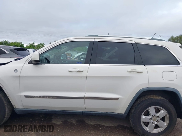 2012 Jeep Grand Cherokee Laredo with VIN 1C4RJFAG5CC224032, listed as a IAAI auction lot 42069334 with 106,614 mi miles. Bid and sale history available at carsss.com. Image 15.