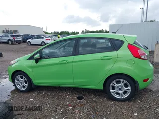 2014 Ford Fiesta SE z VIN 3FADP4EJ8EM233754, wystawiony jako IAAI lot #42108955 z przebiegiem 113 325 mil mil oraz . Historia ofert i sprzedaży dostępna na DreamBid. Obrazek 14.