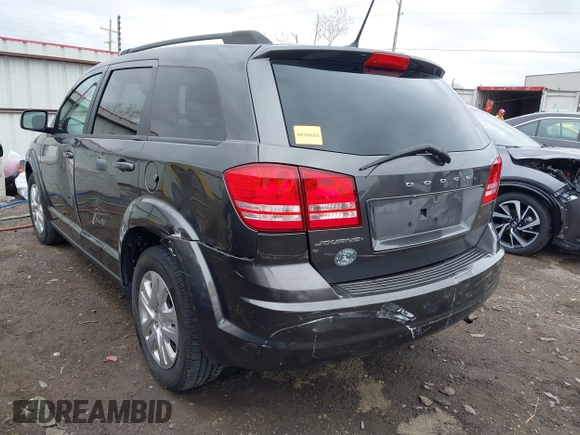2017 Dodge Journey SE with VIN 3C4PDCAB9HT603595, listed as a IAAI auction lot 41914690 with 104,960 mi miles and . Bid and sale history available at DreamBid. Image 6.