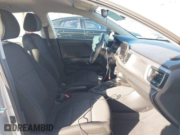 2023 Kia Rio LX with VIN 3KPA24AD1PE599290, listed as a IAAI auction lot 41023283 with 10,027 mi miles and . Bid and sale history available at DreamBid. Image 5.