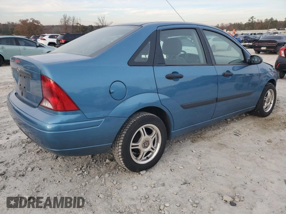 2001 Ford Focus LX with VIN 1FAHP33P01W332260, listed as a Copart auction lot 83221654 with 104,028 mi miles and Salvage Title. Bid and sale history available at DreamBid. Image 3.