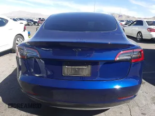 2023 Tesla Model 3 with VIN 5YJ3E1EA5PF652212, listed as a Copart auction lot 57348395 with 8,780 mi miles and Salvage title. Bid and sale history available at DreamBid. Image 6.