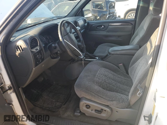 2004 GMC Envoy SLE with VIN 1GKDS13S542233286, listed as a Copart auction lot 76129164 with 228,981 mi miles and Salvage Title. Bid and sale history available at DreamBid. Image 7.
