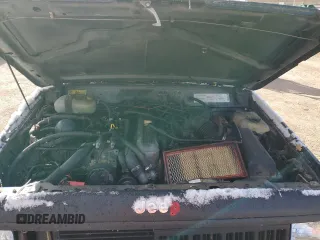 1990 Jeep Cherokee z VIN 1J4FJ28L1LL100736, wystawiony jako Copart lot #81339574 z przebiegiem 160 363 mil mil oraz Czysty tytuł • Clean title. Historia ofert i sprzedaży dostępna na DreamBid. Obrazek 11.