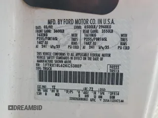 2002 Ford F-150 XL with VIN 1FTRX18L62KC53807, listed as a Copart auction lot 57463075 with 173,301 mi miles and Salvage title. Bid and sale history available at DreamBid. Image 12.