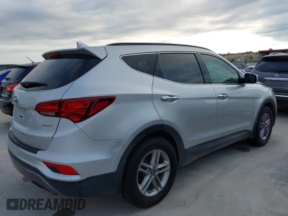 2017 Hyundai Santa Fe 2.4L with VIN 5XYZU3LB4HG464876, listed as a IAAI auction lot 42693100 with 127,888 mi miles and . Bid and sale history available at DreamBid. Image 4.