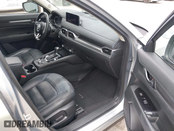 2023 Mazda CX-5 S Carbon Edition z VIN JM3KFBCM3P0197796, wystawiony jako IAAI lot #42408301 z przebiegiem 46 169 mil mil oraz . Historia ofert i sprzedaży dostępna na DreamBid. Obrazek 5.