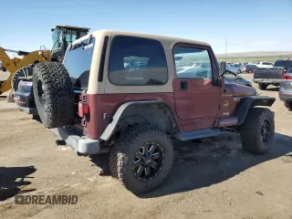 2002 Jeep Wrangler Sahara with VIN 1J4FA59S12P704608, listed as a Copart auction lot 69146504 with 125,920 mi miles and Salvage Title. Bid and sale history available at carsss.com. Image 3.