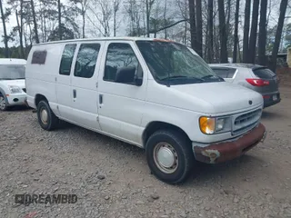 2001 Ford Econoline Cargo with VIN 1FTRE14261HA74696, listed as a IAAI auction lot 41915335 with 124,282 mi miles. Bid and sale history available at carsss.com. Image 1.