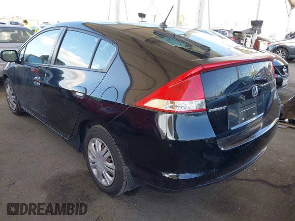 2010 Honda Insight LX with VIN JHMZE2H54AS021815, listed as a IAAI auction lot 42259951 with 137,436 mi miles and . Bid and sale history available at DreamBid. Image 3.