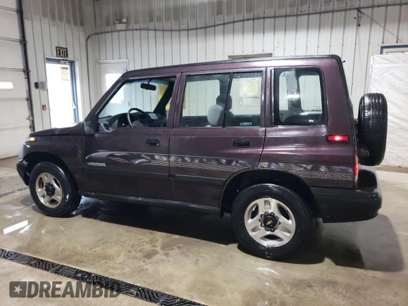 1998 Chevrolet Tracker z VIN 2CNBJ1362W6919635, wystawiony jako Copart lot #56894355 z przebiegiem 140 298 mil mil oraz Szkoda całkowita • Salvage title. Historia ofert i sprzedaży dostępna na DreamBid. Obrazek 2.