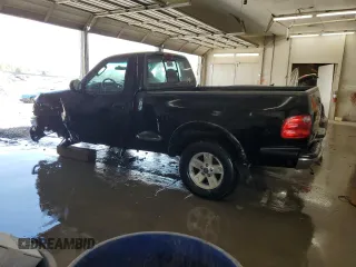 2003 Ford F-150 with VIN 2FTRF08L03CA03160, listed as a Copart auction lot 51591535 with 220,630 mi miles and Salvage title. Bid and sale history available at DreamBid. Image 2.