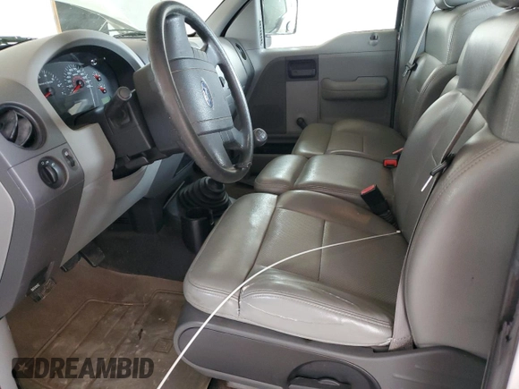 2007 Ford F-150 XL with VIN 1FTRF12297NA82401, listed as a Copart auction lot 58295705 with 198,470 mi miles and Salvage title. Bid and sale history available at DreamBid. Image 7.