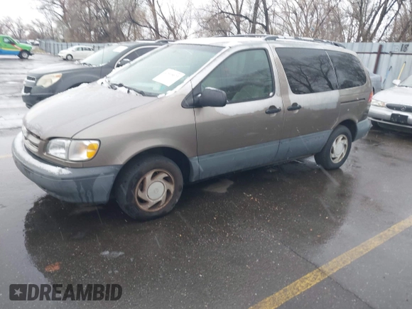 1999 Toyota Sienna LE with VIN 4T3ZF13C9XU164032, listed as a IAAI auction lot 41916673 with 296,628 mi miles and . Bid and sale history available at DreamBid. Image 2.