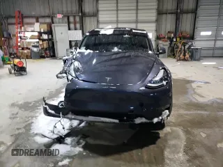 2023 Tesla Model Y Long Range z VIN 7SAYGAEE3PF968231, wystawiony jako Copart lot #45811385 z przebiegiem Nie podano mil oraz Szkoda całkowita • Salvage title. Historia ofert i sprzedaży dostępna na DreamBid. Obrazek 11.