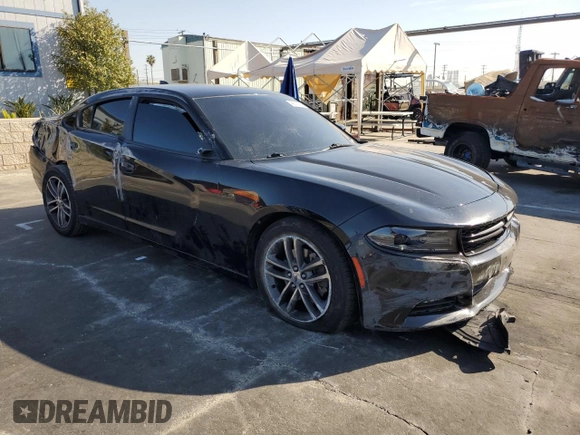 2019 Dodge Charger SXT with VIN 2C3CDXJG8KH757818, listed as a Copart auction lot 49518475 with 98,129 mi miles and Salvage Title. Bid and sale history available at DreamBid. Image 4.