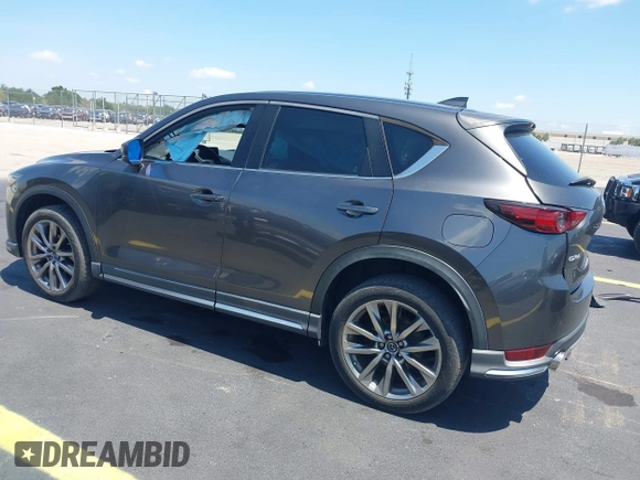 2018 Mazda CX-5 Grand Touring with VIN JM3KFADM8J1310328, listed as a IAAI auction lot 42322780 with 106,378 mi miles and . Bid and sale history available at DreamBid. Image 3.