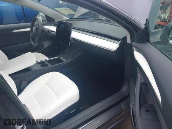 2023 Tesla Model 3 with VIN 5YJ3E1EAXPF628911, listed as a IAAI auction lot 42362410 with 25,387 mi miles and . Bid and sale history available at DreamBid. Image 5.