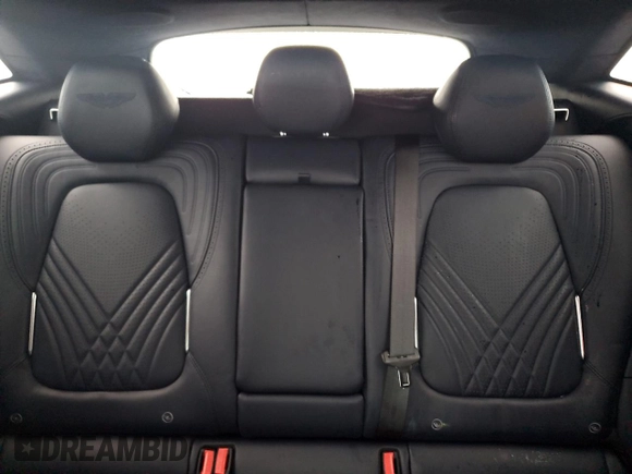 2021 Aston Martin DBX z VIN SCFVUJAW4MTV03930, wystawiony jako Copart lot #73946614 z przebiegiem Nie podano mil oraz Nie do naprawy. Historia ofert i sprzedaży dostępna na DreamBid. Obrazek 10.